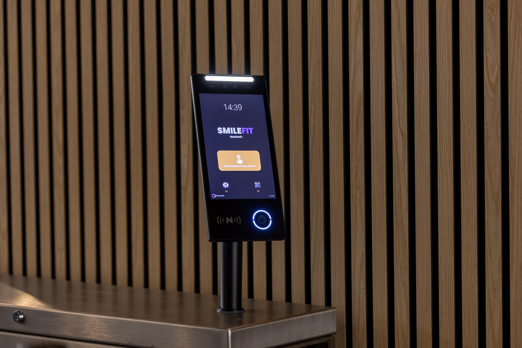Facetronic IDA Reader on a stand at the club entrance, club logo on the display